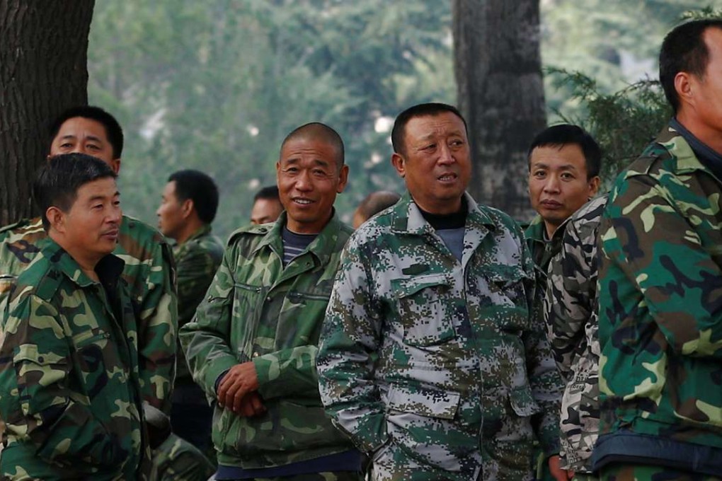 Uniformed protesters outside the Ministry of National Defence building in Beijing. Photo: Reuters