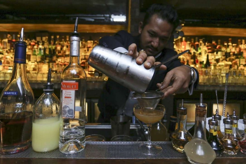 Stockton bar manager Suraj Gurung mixes his version of the famed Sidecar. Photo: Jonathan Wong