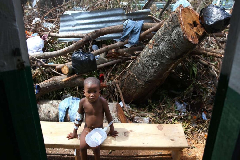 A child sick with cholera receives medical assistance at Saint Antoine hospital in Jeremi, Haiti. Photo: EPA