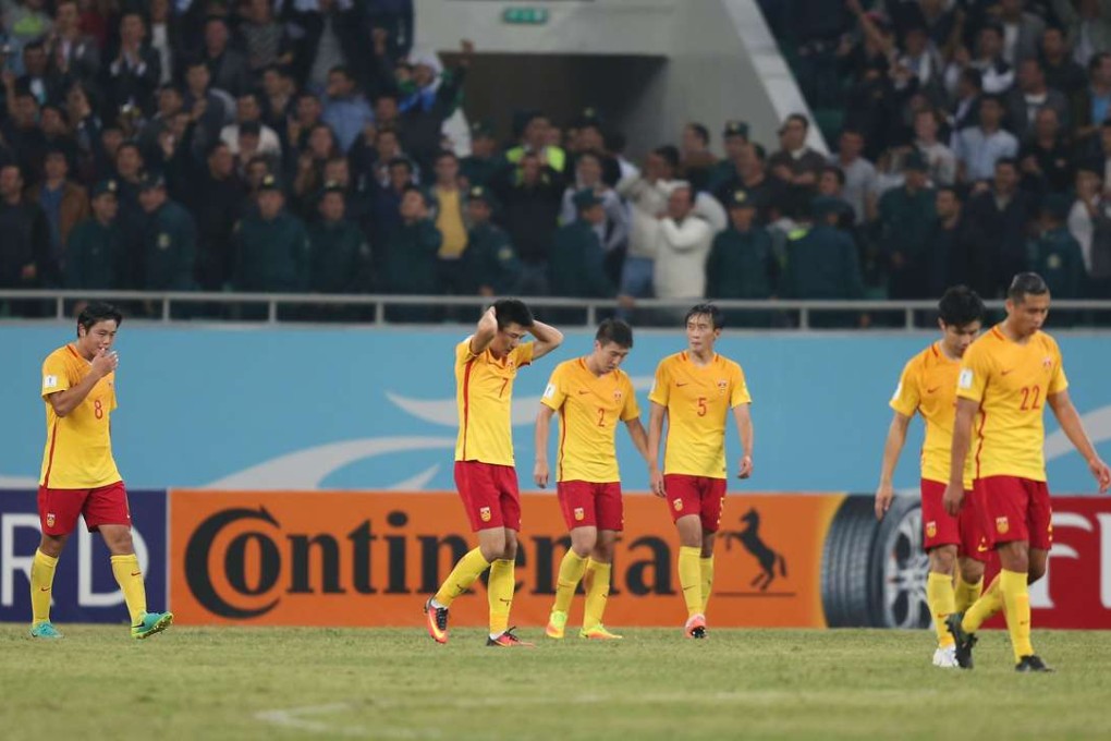China players are disappointed as they leave the pitch after their 0-2 loss to Uzbekistan in Tashkent. Photo: Xinhua