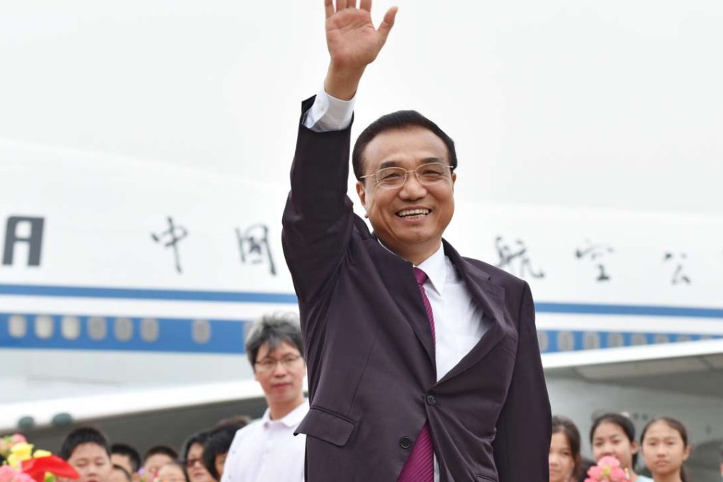 Premier Li Keqiang, waves to the crowd at the end of his three-day trip visit to Macau. Photo: SCMP Handout