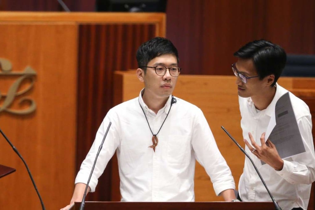 First-time lawmakers Nathan Law (left) and Eddie Chu during the oath-taking session for the sixth Legislative Council. Photo: Sam Tsang