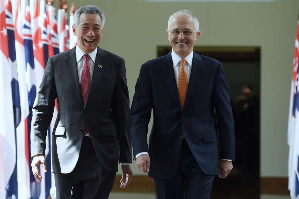 Singapore Prime Minister Lee Hsien Loong and Australian Prime Minister Malcolm Turnbull leave the House of Representatives. Photo: EPA