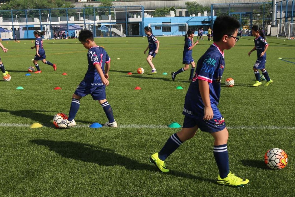 Children play football at the Kitchee sports centre in Sha Tin on October 4. The HK$84 million training centre is barely a year old. Photo: David Wong