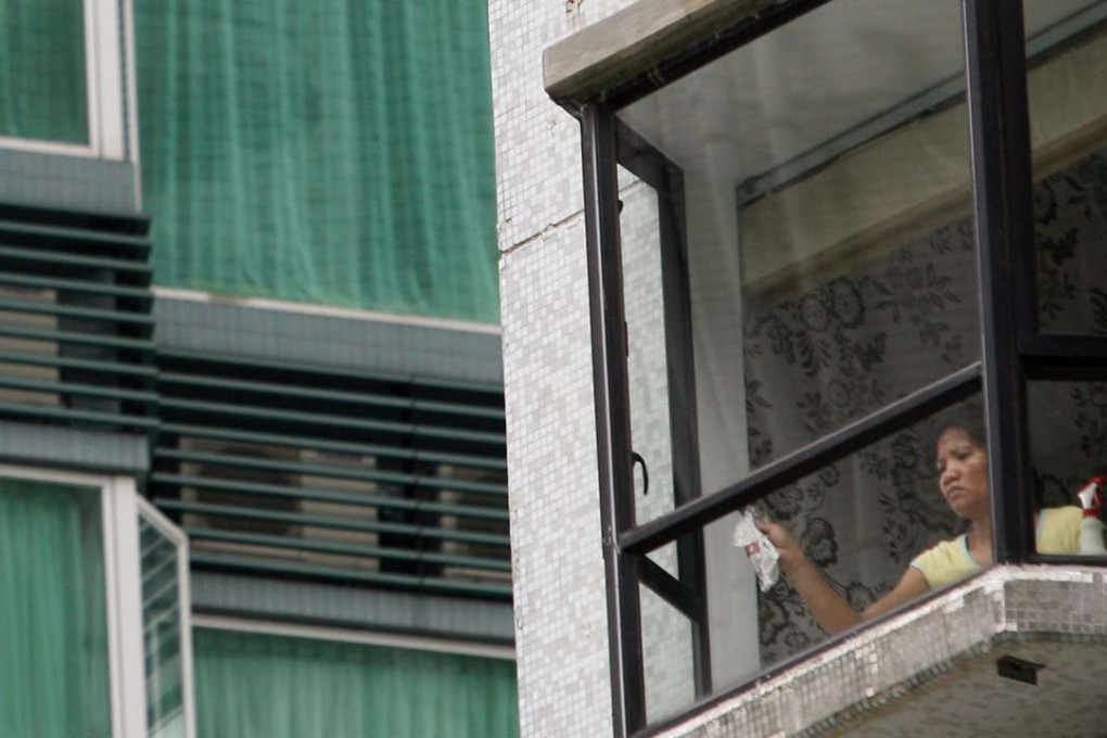 Fewer helpers will be cleaning the outsides of windows from now on. Photo: David Wong