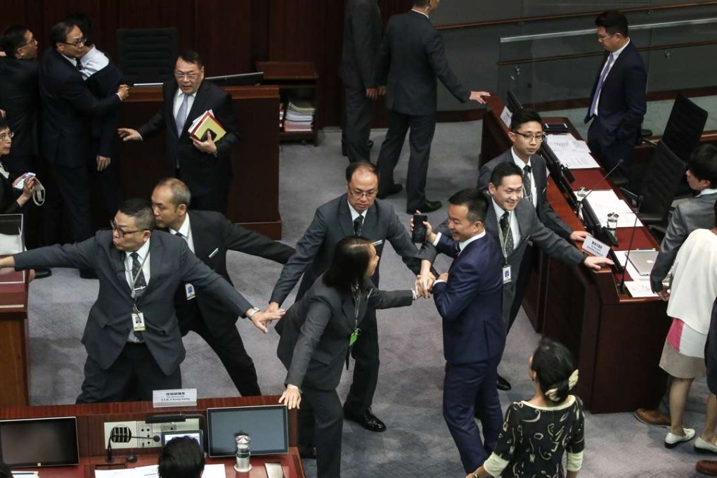 Lawmakers clash during the Legislative Council’s presidential election session, in just one of many angry exchanges at yesterday’s meeting. Photo: Sam Tsang