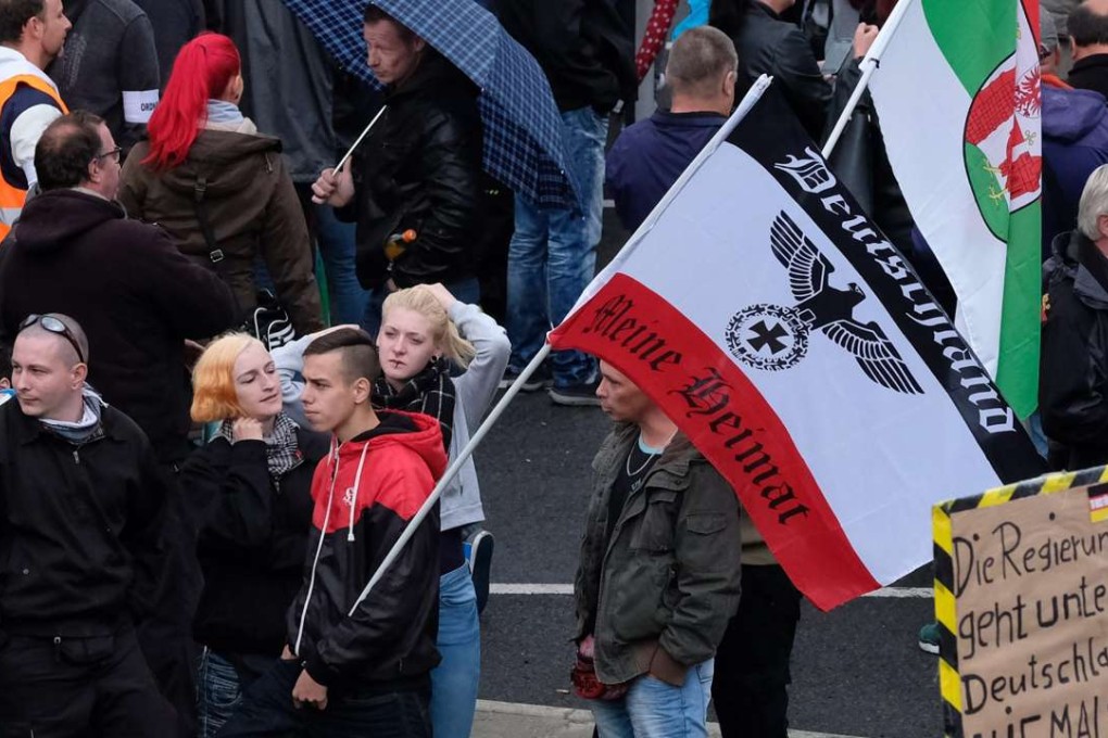 Sympathizers of the far-right Pegida movement gather for a rally in Dresden, Germany,on October 3, German Unity Day. Photo: EPA