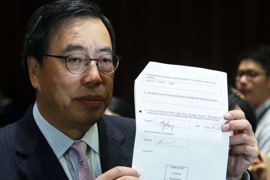 Andrew Leung Kwan-yuen presenting a stamped certificate from the UK Home Office confirming he had renounced his British nationality. Photo: Sam Tsang