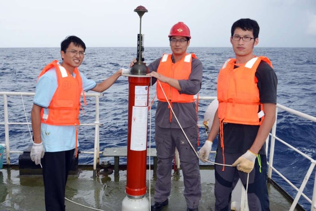 Members of China’s Argo project deploy a floating sensor in the South China Sea. Photo: SCMP Pictures