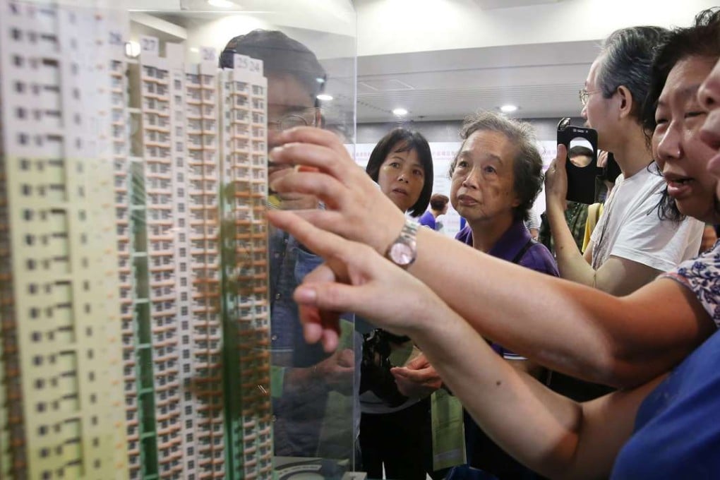 Potential buyers examine models at the Housing Authority customer service centre in Lok Fu. Photo: Edmond So