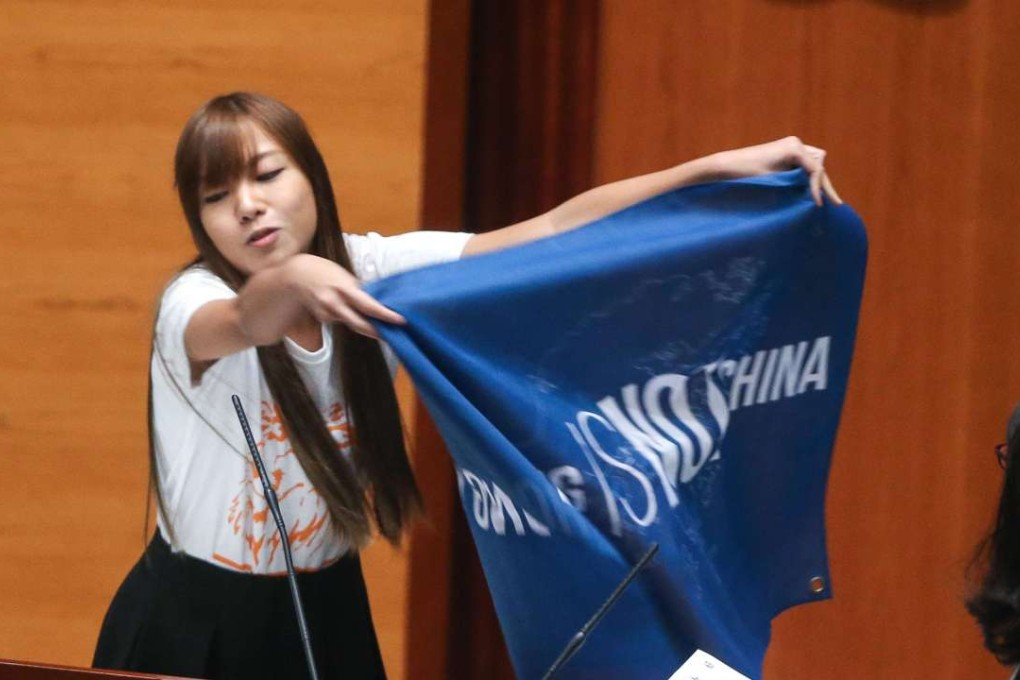 Youngspiration’s Yau Wai-ching makes a political point in the Legco chamber. Photo: Dickson Lee