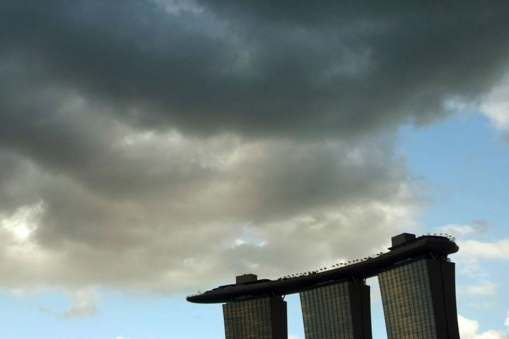 Clouds gather above the Marina Bay Sands resort in Singapore. Photo: Reuters