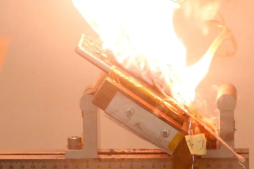 A Samsung Note 7 phone catches fire after pressure is applied to its fully charged battery during a test at the Applied Energy Hub battery laboratory in Singapore. Photo: reuters