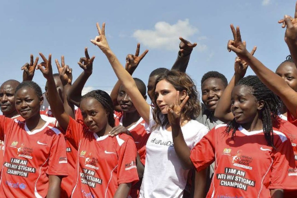 Victoria Beckham with a Kenyan girls’ soccer team during her visit to the African country as a UNAids goodwill ambassador. Photo: Courtesy of Victoria Beckham