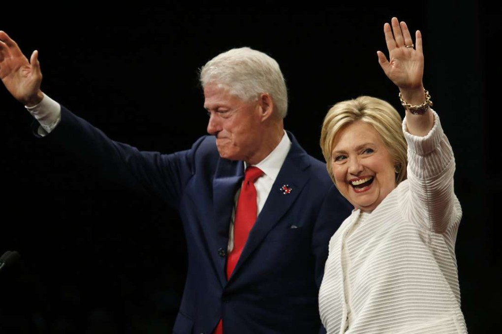 Democratic presidential candidate Hillary Clinton and former President Bill Clinton wave to her supporters at a rally in Brooklyn, New York, after clinching the nomination on Tuesday, June 7, 2016. (Carolyn Cole/Los Angeles Times/TNS)