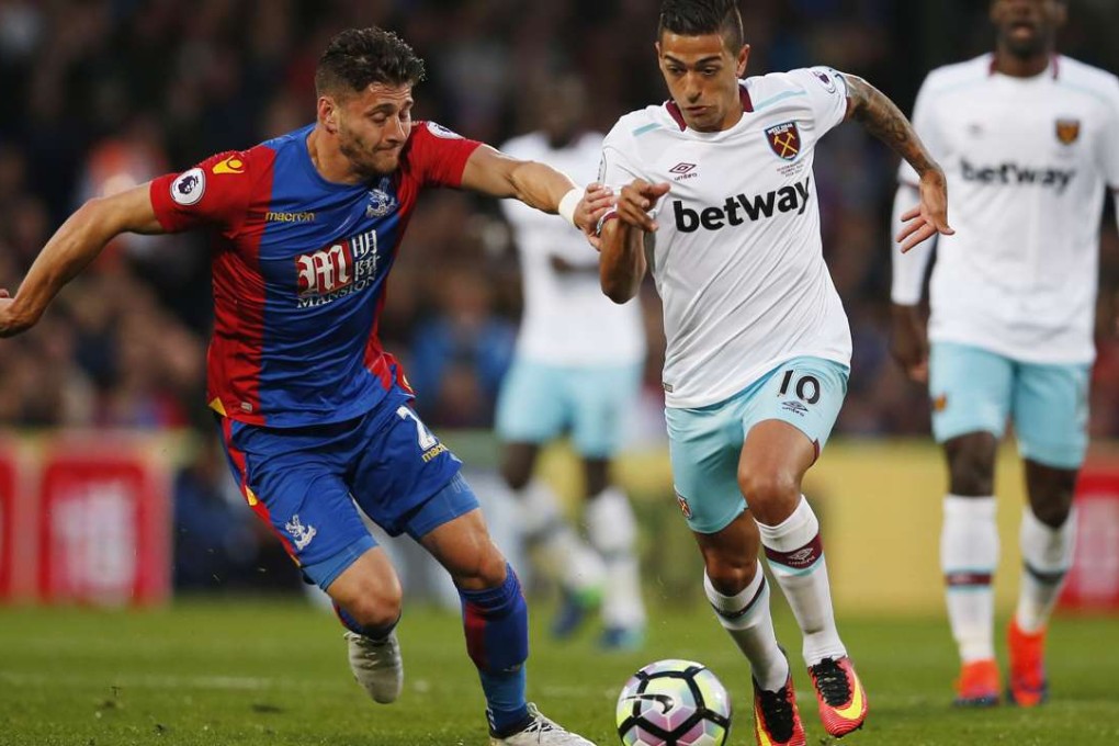 West Ham United's Manuel Lanzini in action with Crystal Palace's Joel Ward. Photos: Reuters