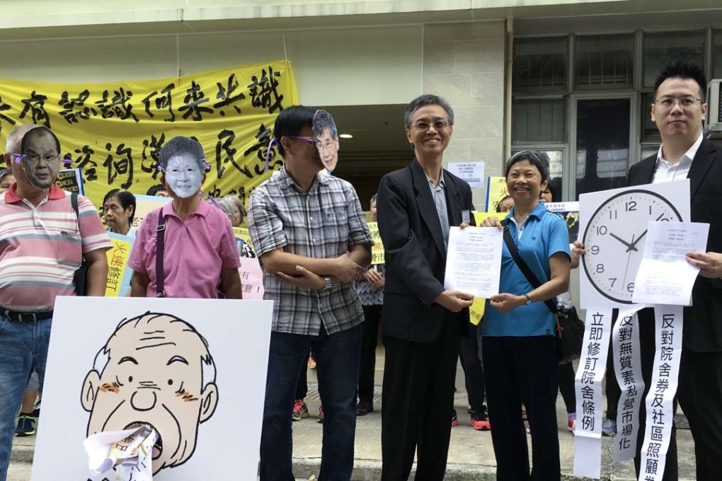 Concern groups handed petition letters to Hong Kong University social work associate professor Ernest Chui Wing-tak and Labour and Welfare Bureau principal assistant secretary Steve Tse Ling-chun ahead of the consultation forum. Photo: SCMP Pictures