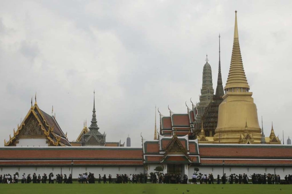 Mourners leave after paying their respects to the late Thai King Bhumibol Adulyadej at the Grand Palace in Bangkok. Photo: AP