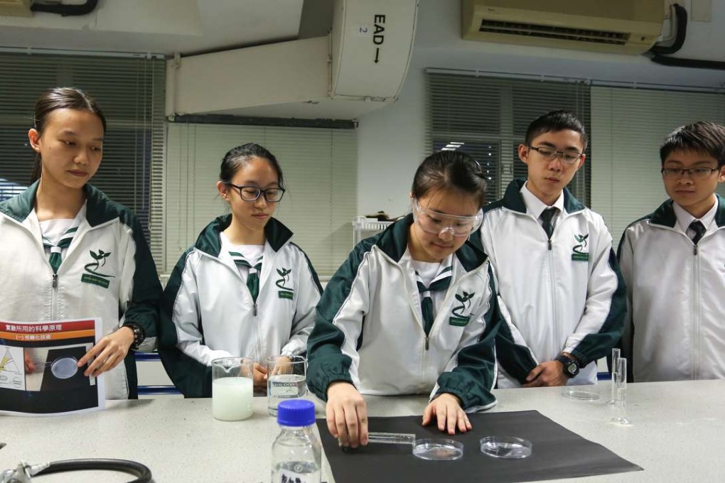 Students from Shun Tak Fraternal Association Yung Yau College (left to right) Leann Lo Li-yan, Kathrine Choi Yan-ching, Rex Ho Yik-lung, and Tommy Au Kwan-yiu, winners of the Space Science Experiment Design Competition for Hong Kong Secondary School Students. Photo: Jonathan Wong