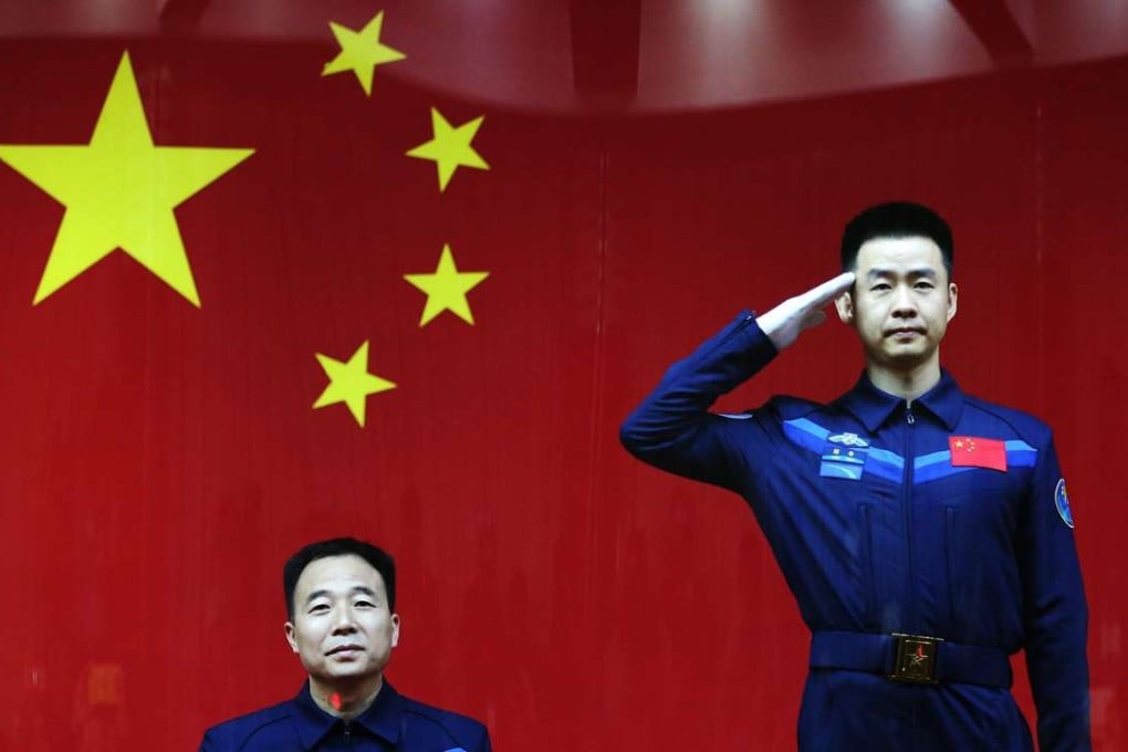 Shenzhou XI mission commander Jin Haipeng (left) is a major general in the People’s Liberation Army, while crew member Chen Dong is a colonel. Photo: EPA