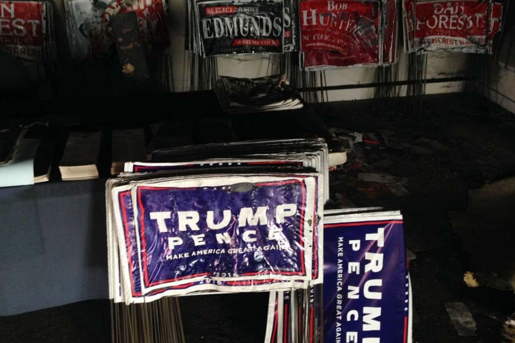 Melted campaign signs are seen at the Orange County Republican Headquarters in Hillsborough, North Carolina, on Sunday, after a firebomb attack. Photo: AP