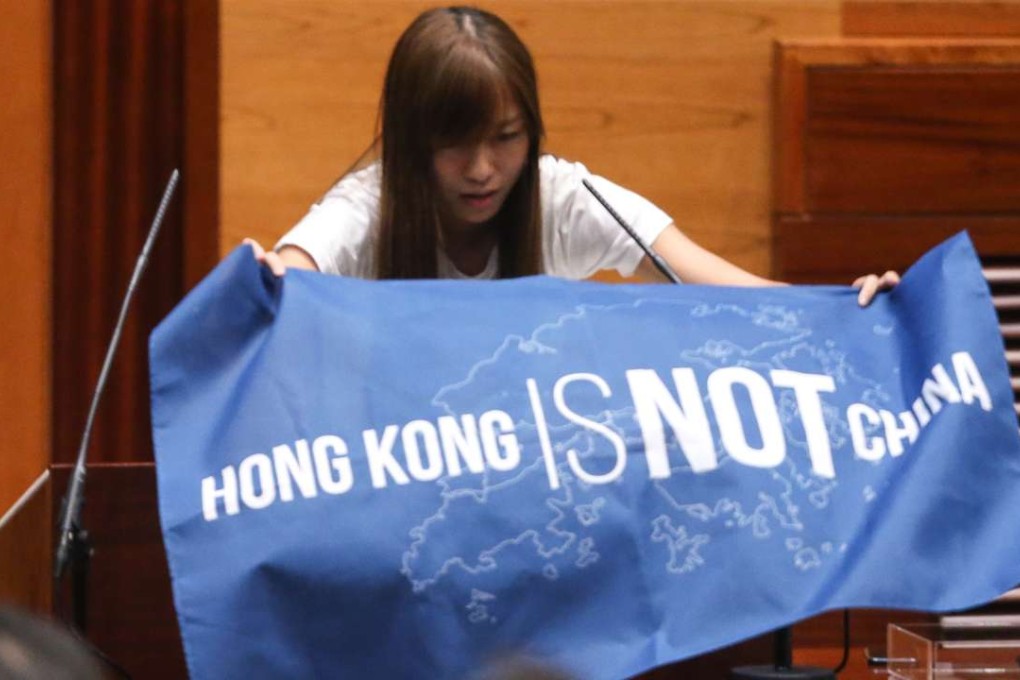 Yau Wai-ching displays a banner during her oath-taking last week. It is aggrieving that young localists could stoop so low as to refer to China as “Cheena”, a variation of the derogatory term “Shina” once used by the Japanese. Photo: Sam Tsang
