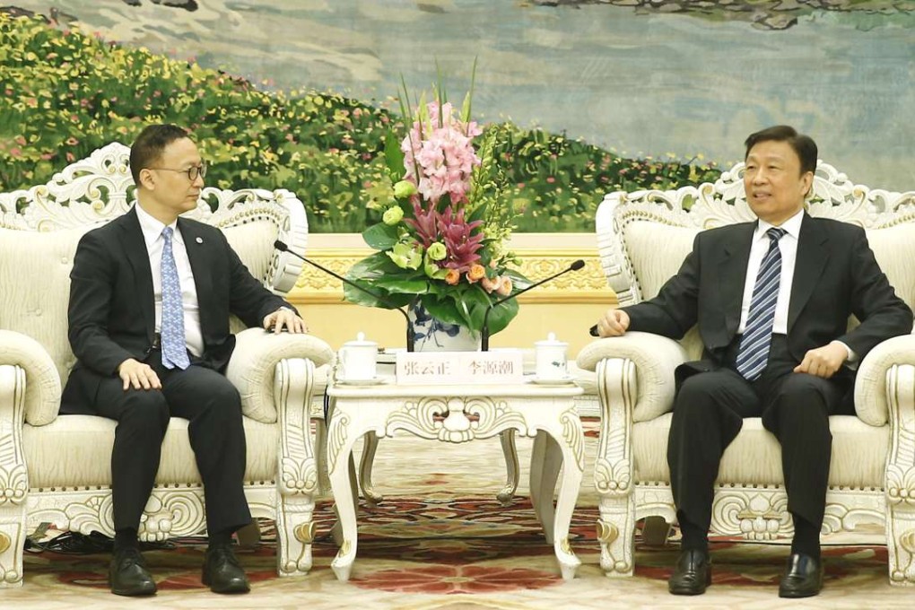 Secretary for the Civil Service Clement Cheung with Vice-President Li Yuanchao in Beijing on Tuesday. Photo: CNS Images