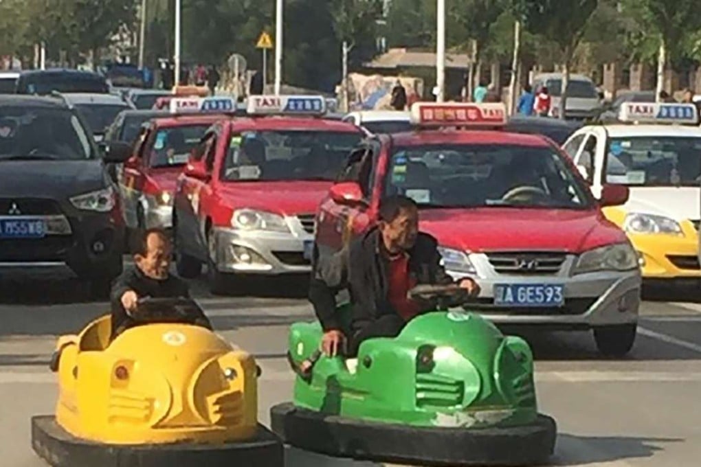Two men were spotted driving bumper cars in traffic in Shenyang on Saturday morning. Photo: SCMP Pictures