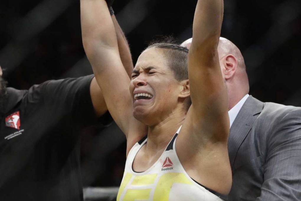 Amanda Nunes celebrates after defeating Miesha Tate. Photo: AP