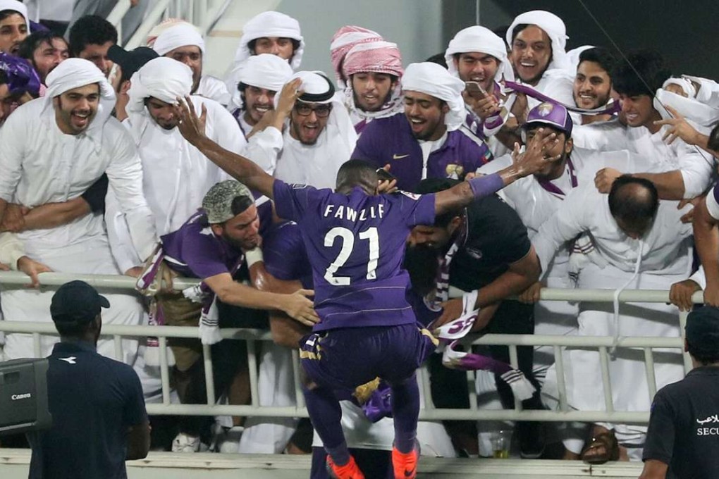Al-Ain's Fawzi Fayez (C) celebrates during the Asian Champions League football return match between Qatar's El-Jaish and UAE's Al-Ain on October 18, 2016 at the Abdullah Bin Khalifa Stadium in Doha. / AFP PHOTO / KARIM JAAFAR