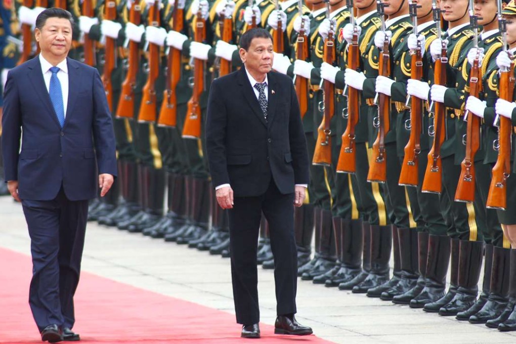 President Xi Jinping (left) pictured with Rodrigo Duterte as they inspect an honour guard in Beijing. Photo: Simon Song