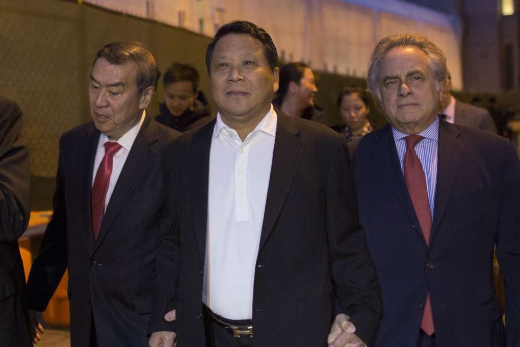 Ng Lap Seng (centre), a Macau billionaire real estate developer, exits the Manhattan US District Courthouse with his lawyers on October 26, 2015. Photo: Reuters
