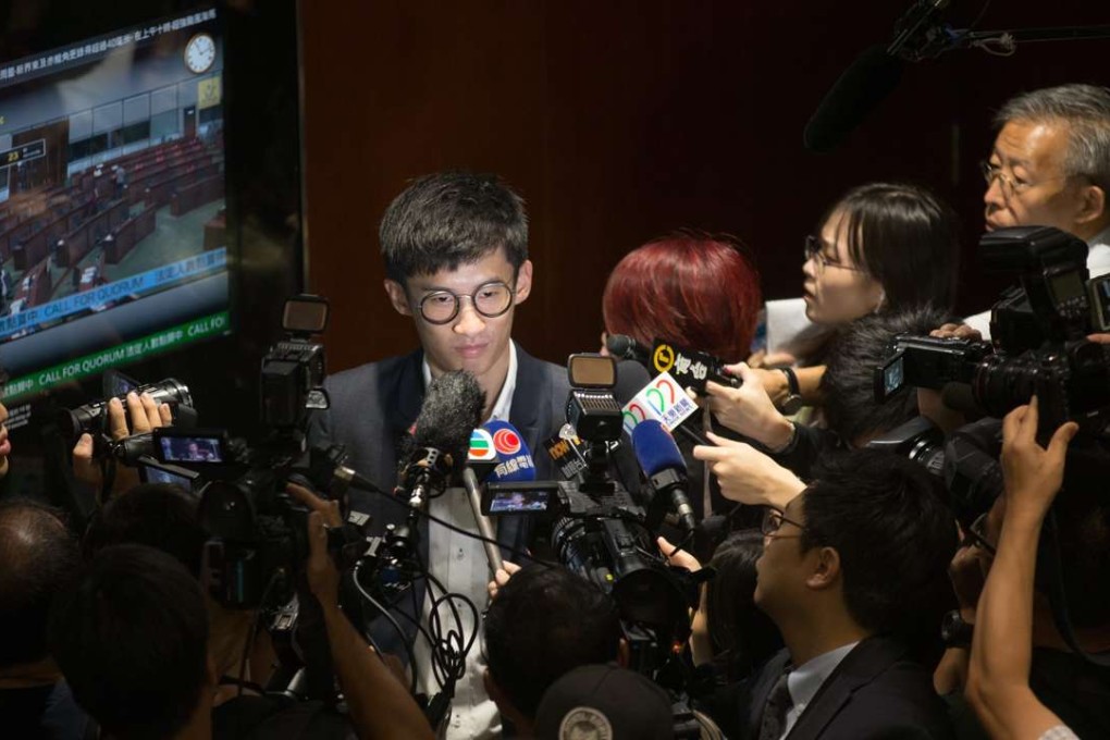 Pro-government lawmakers forced the adjournment of the Legislative Council, preventing the two Youngspiration lawmakers-elect Sixtus 'Baggio' Leung, and Yau Wai-ching as well as a third, Lau Siu-lai, from retaking their oaths of office. Photo: EPA