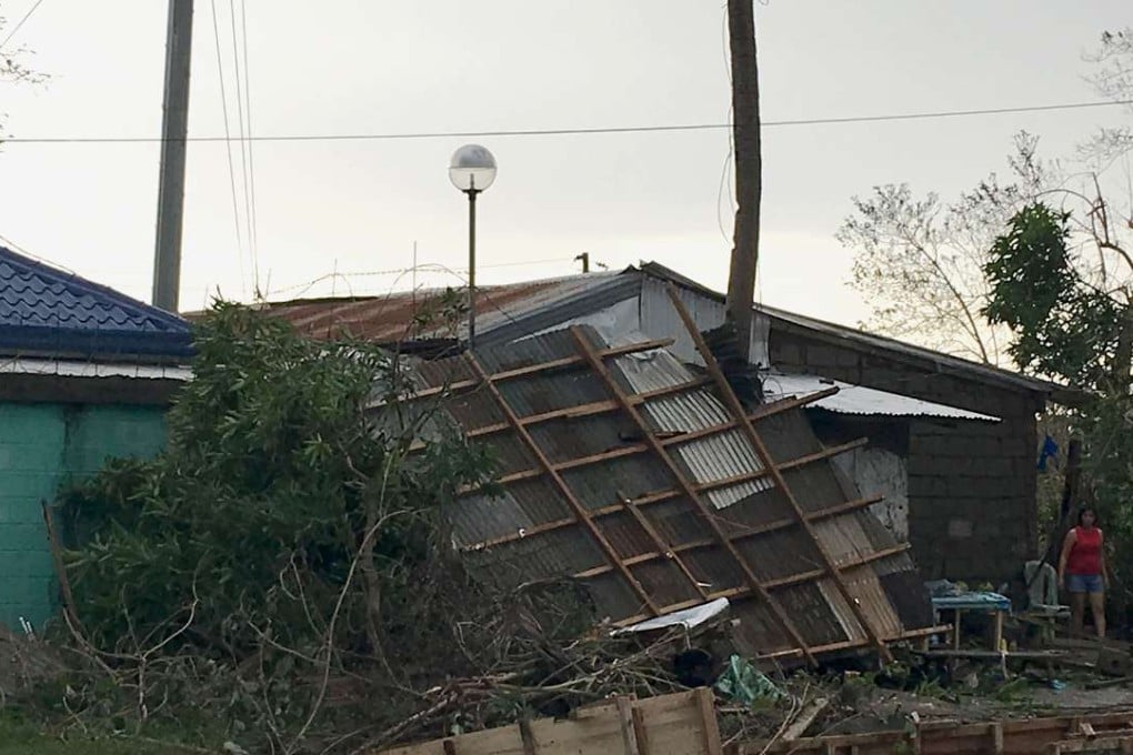 A home partially collapses due to the strong winds caused by Super Typhoon Haima which hit Isabela province, north of Manila. Photo: AFP