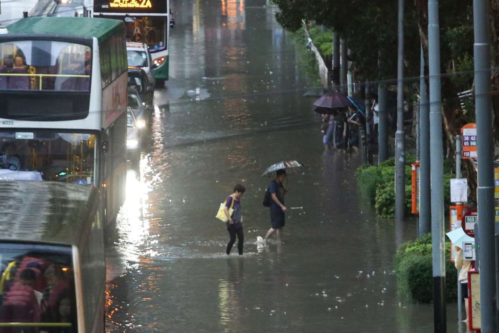 People brave the flood in Causeway Bay. Photo: Sam Tsang