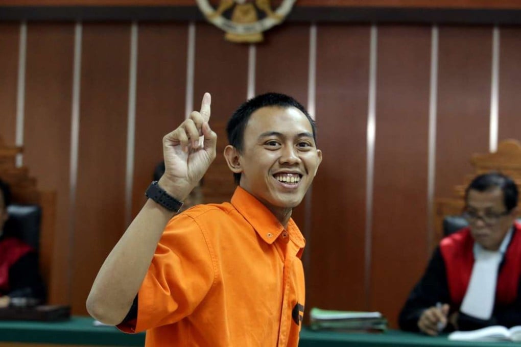 Indonesian militant Dodi Suridi, 23, smiles during his trial in Jakarta. Photo: EPA