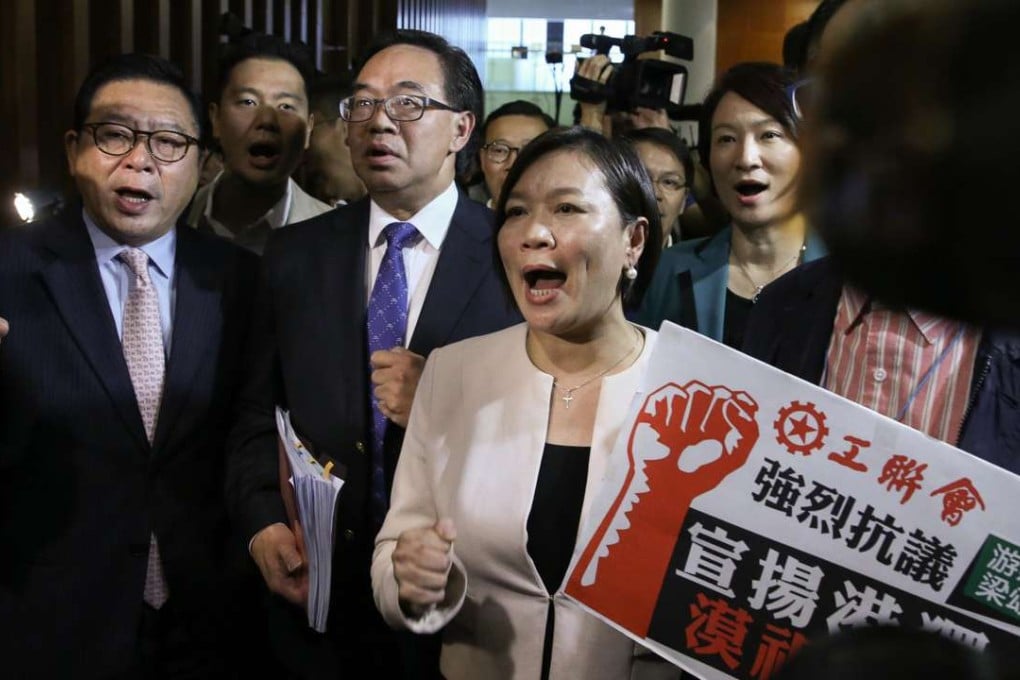 Pro-establishment lawmakers protest against localists Baggio Leung and Yau Wai-ching. Photo: Sam Tsang