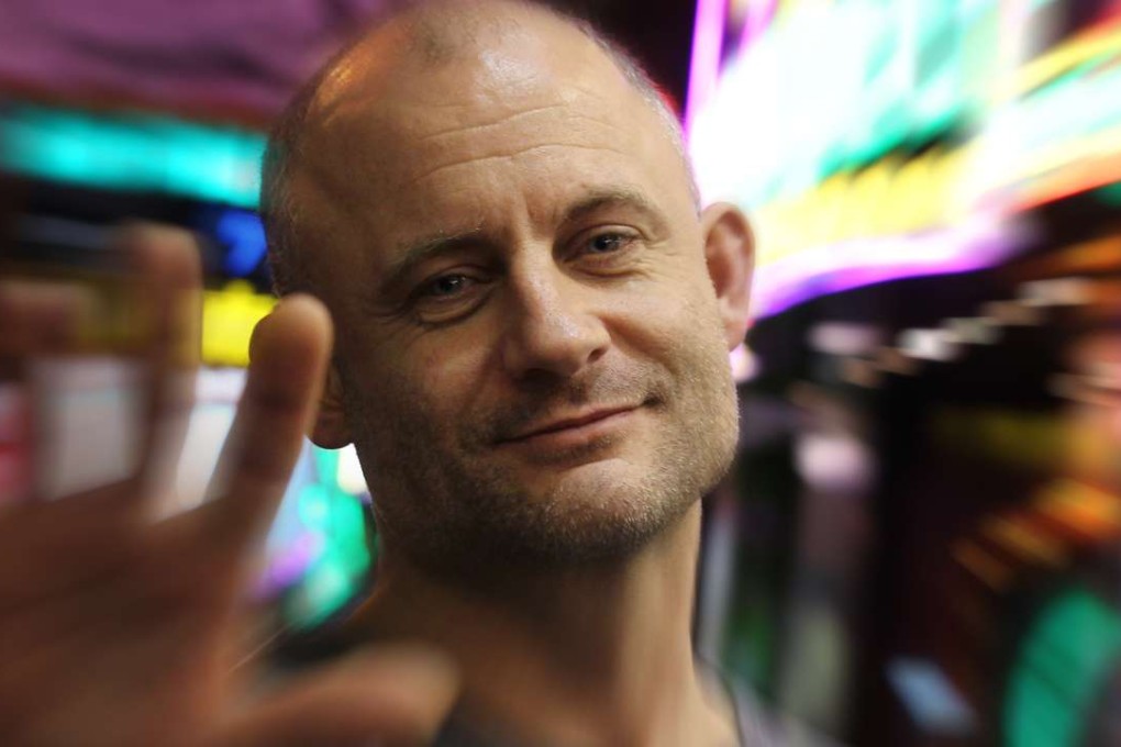 Chris Thrall in Wan Chai, where he once lived as a homeless drug addict working at a triad-owned nightclub. Photo: Dickson Lee