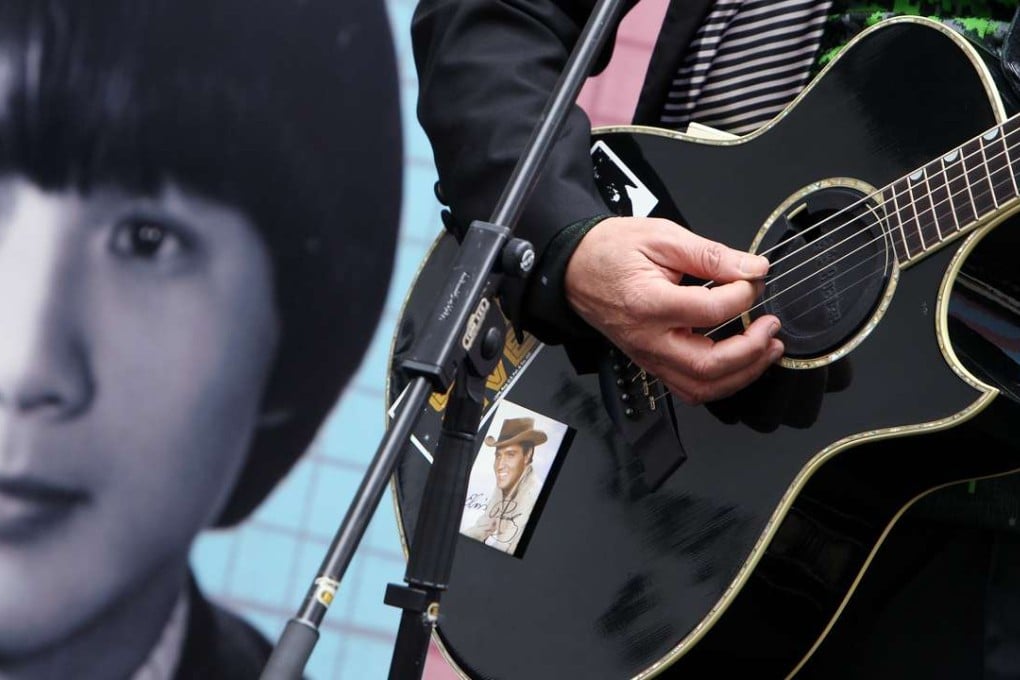 A photo of Elvis Presley seen on the guitar of Sam Hui at a 2012 concert the Canto-pop superstar played at the University of Hong Kong. Photo: Sam Tsang