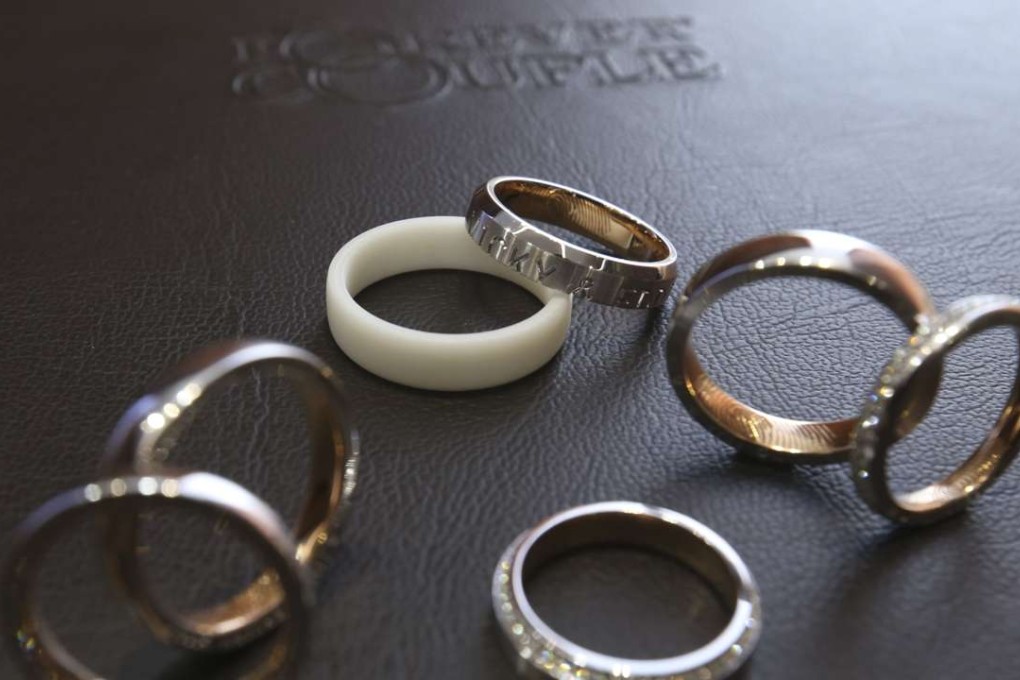 A 3D printed epoxy ring among finished rings at Forever Couple in Wan Chai. Couples can wear the epoxy rings for six months to check their fit before their wedding rings are made. Photo: Dickson Lee