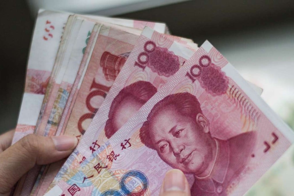 Offshore yuan weakened by 0.4 per cent against the US dollar in Hong Kong on Friday, its weakest since it began trading in 2010. Photo: AFP