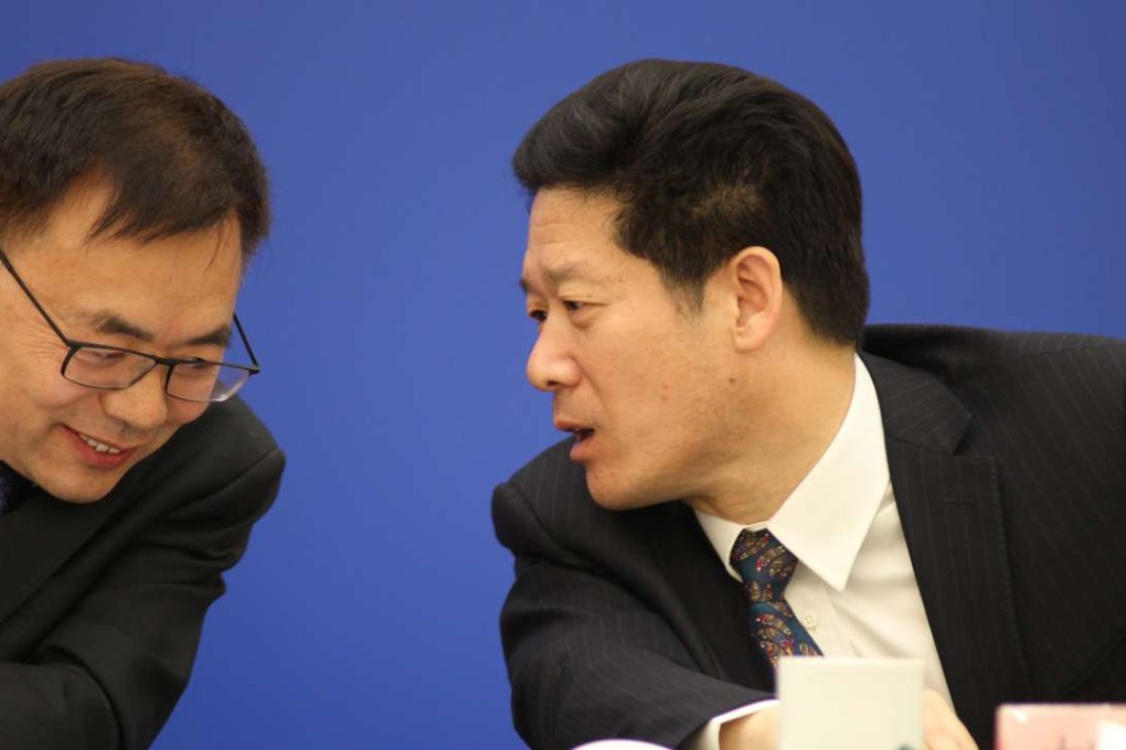 The mainland passed the new NGO law in April. Guo Linmao (left), inspector of the social law department with the Legislative Affairs Commission of the Standing Committee of the National People’s Congress, talks with Hao Yunhong, director of overseas non-governmental organisations department of the Ministry of Public Security at a press conference on April 28 after the draft law was passed. Photo: Simon Song