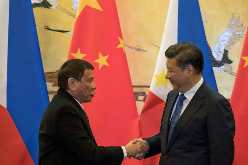 Philippine President Rodrigo Duterte and Chinese President Xi Jinping shake hands after a signing ceremony in Beijing. Photo: Reuters