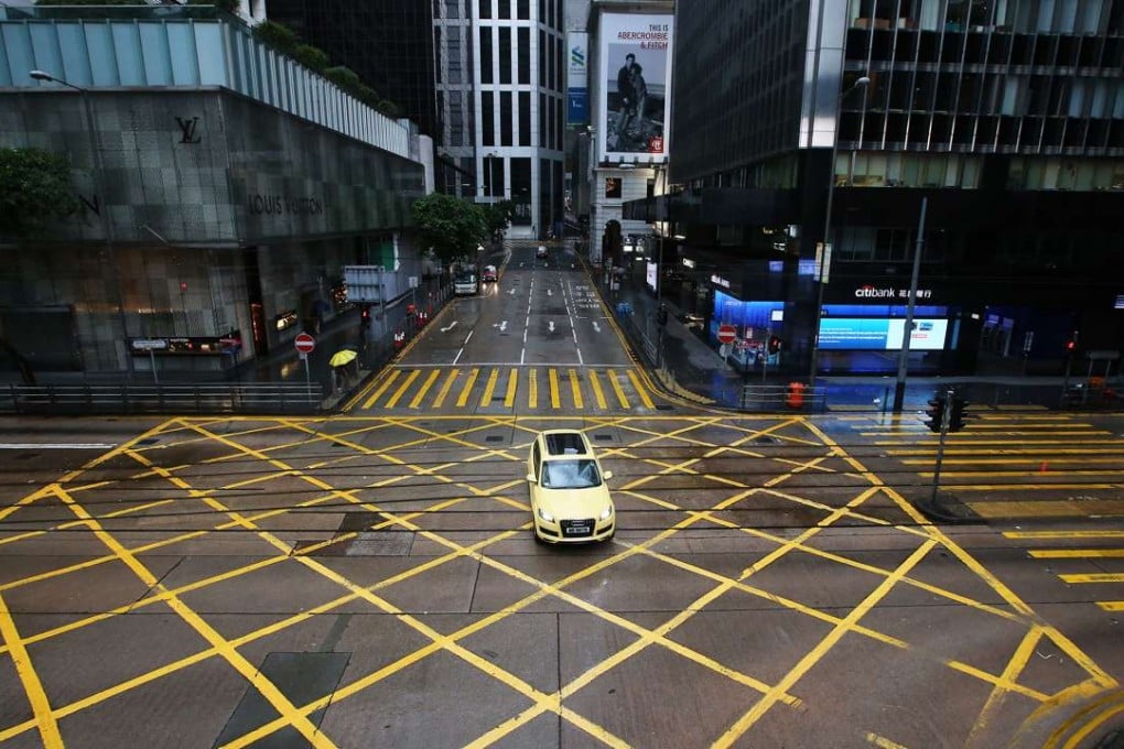 Empty streets in Central commercial area during morning peak hour in Hong Kong. Photo: David Wong
