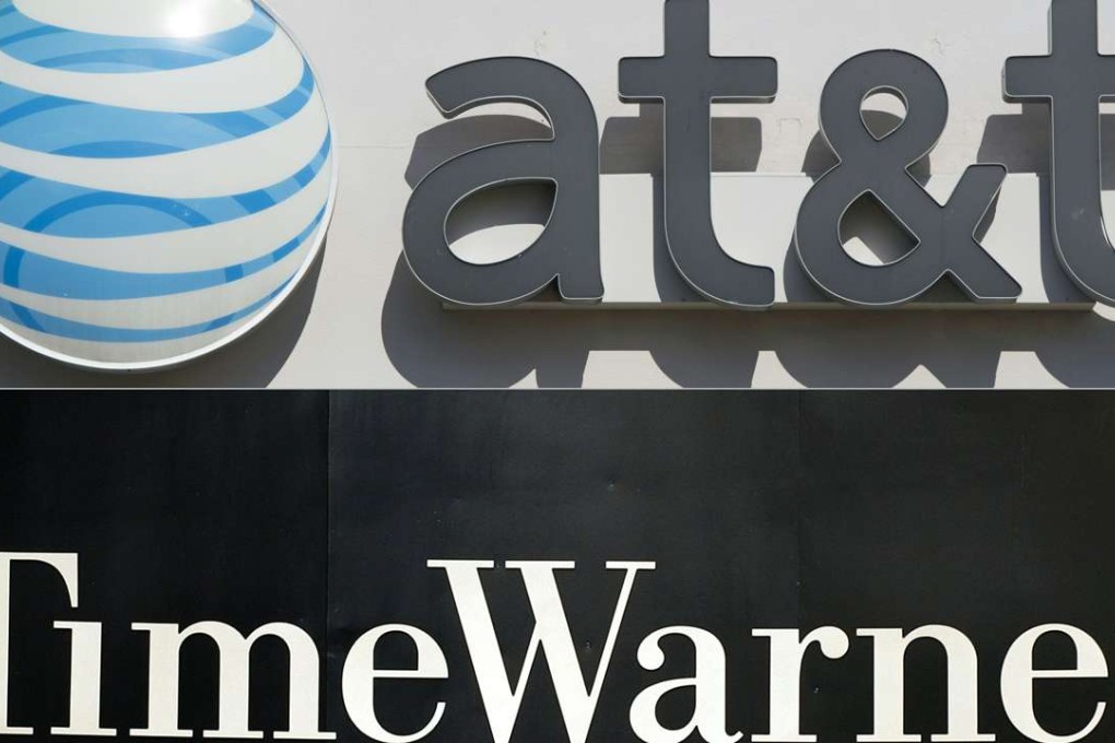 The logos of AT&T and Time Warner as the two giants are reported to be in buyout talks. Photo: AFP