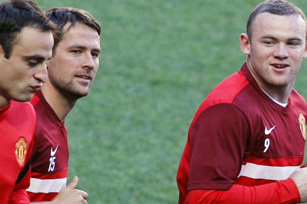 Wayne Rooney (right) and Michael Own (second left). Photo: AFP