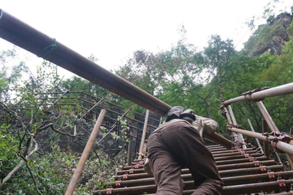 A steel ladder that climbs almost 1,000 metres will connect a mountain village to the outside world more securely. Photo: SCMP Pictures