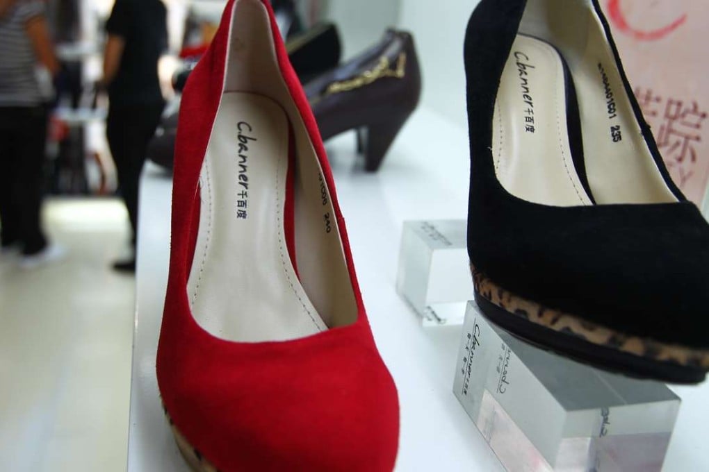 C.banner shoes on display in a shop in Beijing. The company recorded its first buy-back since July last year with 2.16 million shares purchased on October 20 at HK$2.12 each. Photo: Simon Song