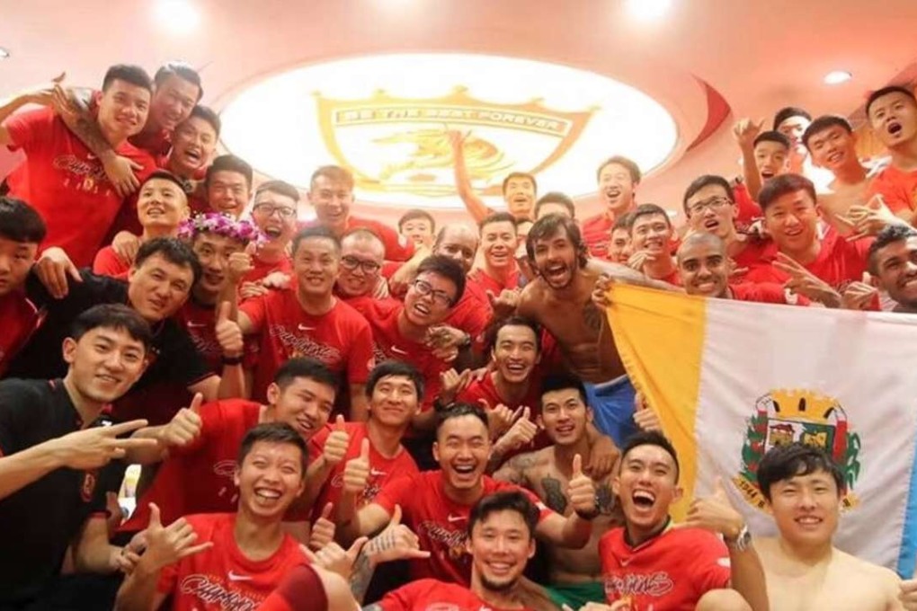 Guangzhou Evergrande players pose for a photo in their dressing room after sealing a sixth league title. Photo: Weibo