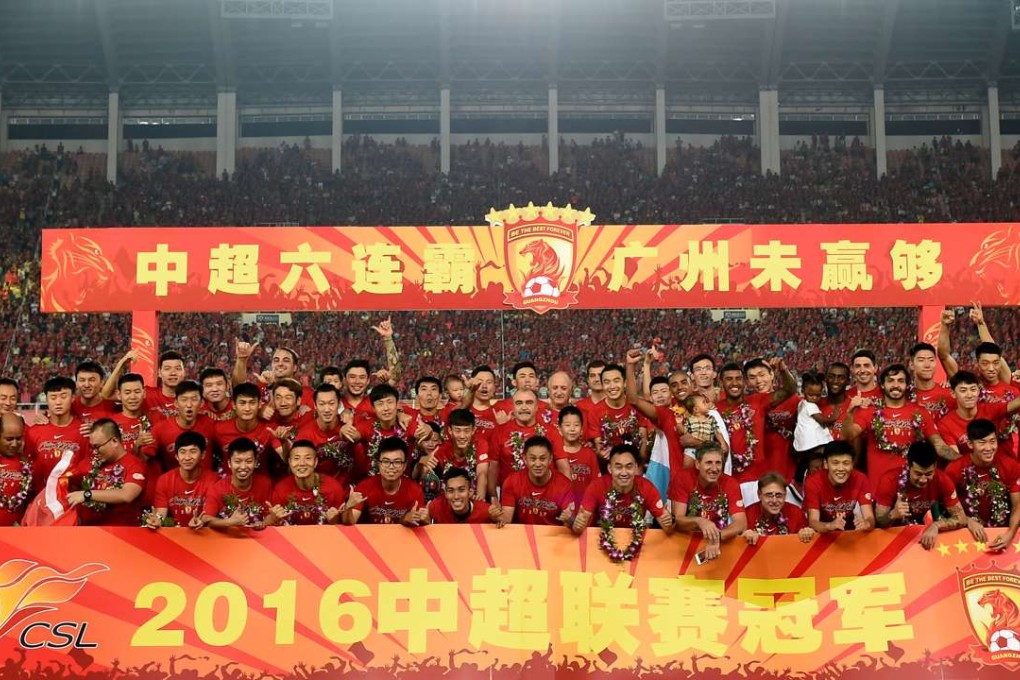 Guangzhou celebrate the title. Xinhua